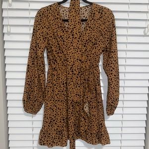Brown spotted wrap dress with belt/tie. Size small. New with tags.